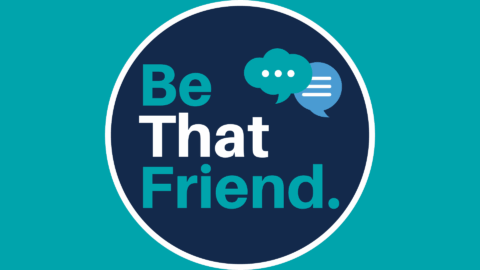 Be That Friend logo (teal and white text on a navy blue circular background; small teal thought bubble and light blue speech bubble in upper right side.) Logo set on a teal background.