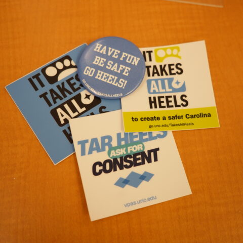 VPAS stickers and buttons promoting prevention and safety messages.